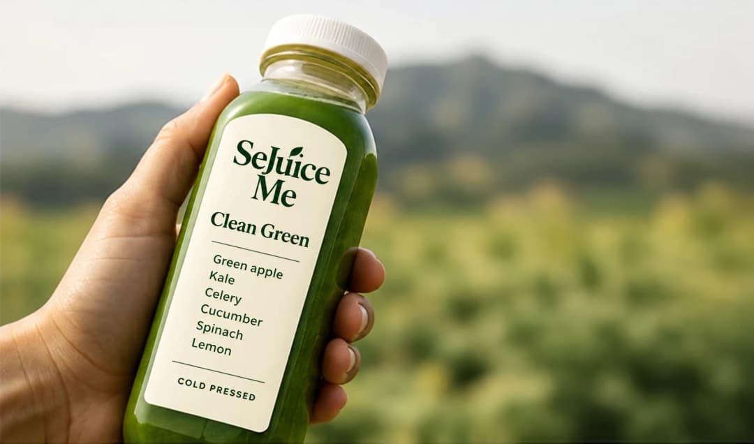 Clean Green bottle mockup held outdoors